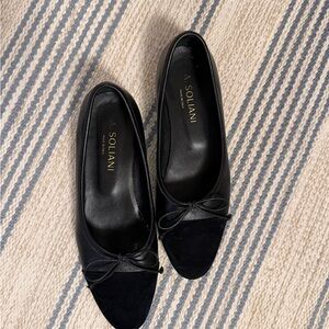 A. Soliani black comp flats. Black leather with suede cap toe.